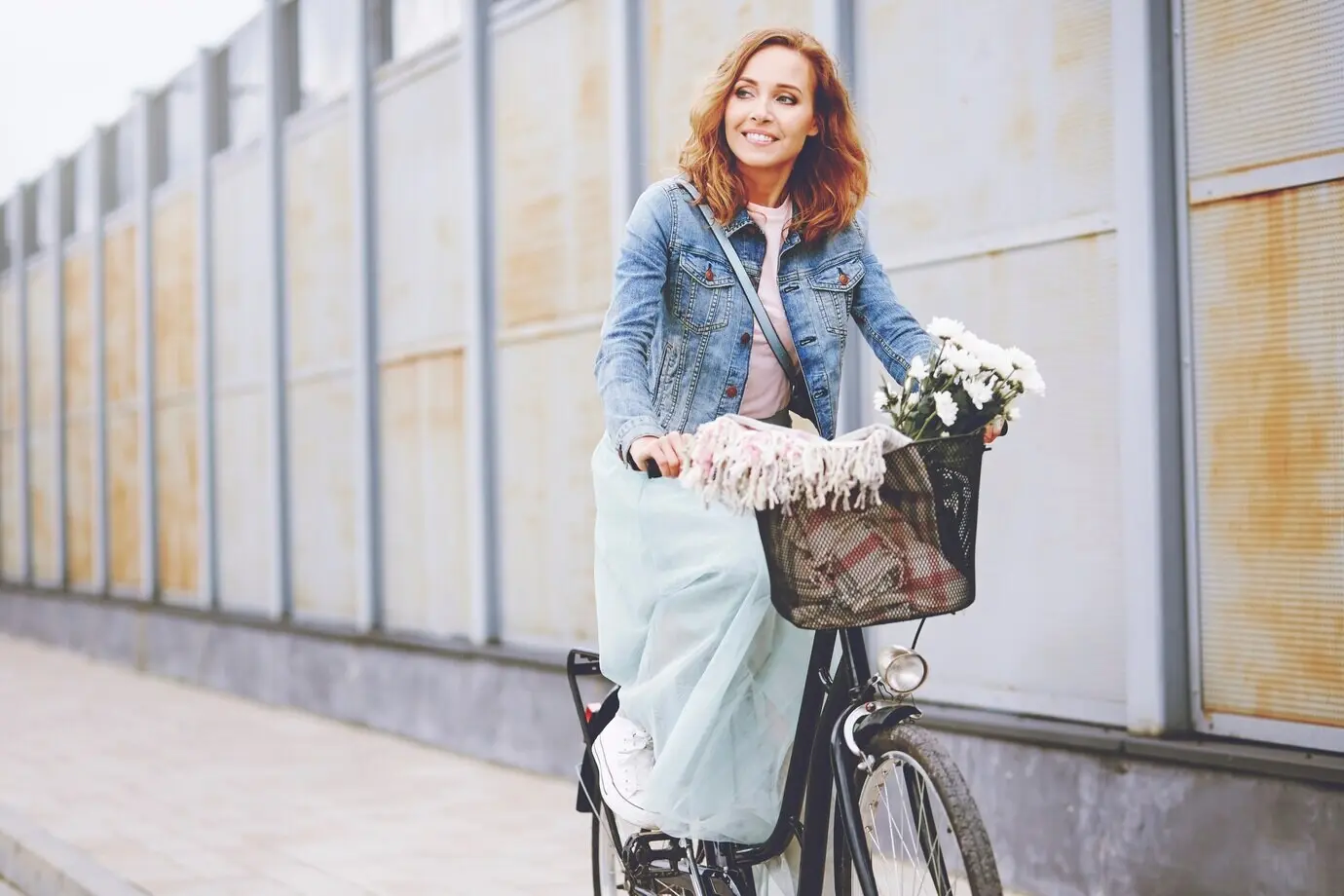 A beautiful woman riding a bike.